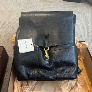 BRAND NEW NEVER BEEN USED IN BOX LOTUFF LEATHER KNAPSACK IN BLACK LEATHER